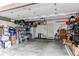 Spacious garage with ample storage shelving and overhead storage at 19149 E 55Th Ave, Denver, CO 80249