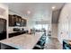 Modern kitchen with stainless steel appliances and a large island at 19149 E 55Th Ave, Denver, CO 80249