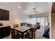 Open-concept living area and dining space filled with natural light at 19149 E 55Th Ave, Denver, CO 80249