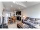Open-concept living room and kitchen area with modern furnishings at 19149 E 55Th Ave, Denver, CO 80249