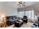 Bright living room with comfortable seating, large windows, and stylish decor for a relaxed ambiance at 19149 E 55Th Ave, Denver, CO 80249