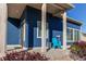 Welcoming front porch with a cozy seating area, perfect for relaxing outdoors at 19149 E 55Th Ave, Denver, CO 80249