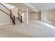 Unfinished basement with stairs and ample space at 8946 S Rome Ct, Aurora, CO 80016