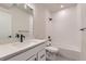 Bathroom featuring a tub, shower and a white vanity at 8946 S Rome Ct, Aurora, CO 80016