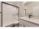 Modern bathroom featuring a sleek glass shower and updated fixtures at 8946 S Rome Ct, Aurora, CO 80016