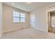 Bedroom with neutral carpet and a view of the neighborhood at 8946 S Rome Ct, Aurora, CO 80016