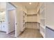 Walk-in closet featuring shelves and rods at 8946 S Rome Ct, Aurora, CO 80016