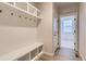 Charming mudroom with built-in bench, hooks, and shelves at 8946 S Rome Ct, Aurora, CO 80016