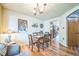 Dining room features a glass top dining table and adjacent archway at 4814 Kingbird Dr, Frederick, CO 80504