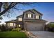 Charming two-story home with a well-maintained lawn, attached garage, and attractive landscaping, offering suburban comfort at 4814 Kingbird Dr, Frederick, CO 80504