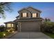 Attractive two-story home featuring a well-manicured lawn, attached garage, and inviting curb appeal, offering comfort at 4814 Kingbird Dr, Frederick, CO 80504