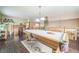 Large, bright game room with a pool table, neutral walls, and dark hardwood flooring, perfect for entertaining at 4814 Kingbird Dr, Frederick, CO 80504