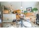 Open concept kitchen offers tiled backsplash, wooden cabinets, and breakfast nook at 4814 Kingbird Dr, Frederick, CO 80504