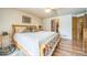 Spacious main bedroom features hardwood floors and ensuite bathroom at 4814 Kingbird Dr, Frederick, CO 80504