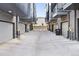 View of the garages showing private entrances and modern architecture at 4395 Zuni St, Denver, CO 80211