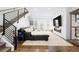 Spacious living room with a modern fireplace, large screen TV, and comfortable seating at 4395 Zuni St, Denver, CO 80211