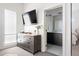 Stylish main bedroom leading to ensuite bathroom, featuring ample storage, and sleek modern finishes at 4395 Zuni St, Denver, CO 80211