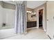 Bathroom with shower-tub, vanity, walk-in closet and tile flooring at 5656 S Sicily Ct, Aurora, CO 80015