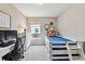 Bright, bedroom with work space, cheerful decor, and comfortable bed at 5656 S Sicily Ct, Aurora, CO 80015