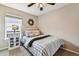 Cozy bedroom featuring a comfortable bed and natural light from window at 5656 S Sicily Ct, Aurora, CO 80015