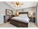 Comfortable primary bedroom with large bed, ceiling fan, and ample natural light at 5656 S Sicily Ct, Aurora, CO 80015