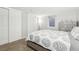 Serene bedroom features a comfortable bed and ample closet space, creating a cozy retreat at 4180 S Elati St, Englewood, CO 80110