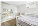 Bright bedroom with built-in bookshelves and shelves, creating a charming and organized space at 4180 S Elati St, Englewood, CO 80110