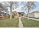 Well-maintained home with a charming front yard, mature trees, and inviting curb appeal at 4180 S Elati St, Englewood, CO 80110