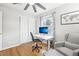 Cozy home office featuring a large window, modern furniture, and closet for ample storage space at 4180 S Elati St, Englewood, CO 80110