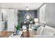 Comfortable living room with stylish decor, accent wall and bright natural light at 9195 E Lehigh Ave # 190, Denver, CO 80237