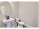 Simple bathroom with pedestal sink and toilet at 9657 Browns Peak Cir, Littleton, CO 80125