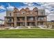 Three-story townhouses with stone accents and private balconies at 9657 Browns Peak Cir, Littleton, CO 80125