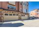 Two-car garage with attached storage space and neutral tones at 9657 Browns Peak Cir, Littleton, CO 80125