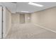 Unfinished basement with concrete floors, high ceilings, and ample space for customization and future expansion at 11704 Elk Head Range Rd, Littleton, CO 80127