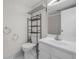 Well-lit bathroom with vanity, mirror, towel rack, toilet and tiled floor at 11704 Elk Head Range Rd, Littleton, CO 80127
