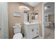This updated bathroom features a modern white vanity, a decorative mirror, and coordinated decor at 11704 Elk Head Range Rd, Littleton, CO 80127