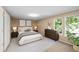 Staged bedroom with natural light, neutral paint, carpet and ample space at 11704 Elk Head Range Rd, Littleton, CO 80127