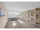 Bright bonus room features skylights, neutral carpeting and a built-in shelving unit, perfect for storage and personalization at 11704 Elk Head Range Rd, Littleton, CO 80127