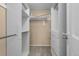 Walk-in closet with custom shelving and storage solutions, designed for organization and convenience at 11704 Elk Head Range Rd, Littleton, CO 80127