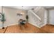 Cozy dining area with parquet floors, staircase, and modern lighting fixture at 11704 Elk Head Range Rd, Littleton, CO 80127