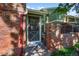 Charming front entry features a brick wall and walkway leading to a green door at 11704 Elk Head Range Rd, Littleton, CO 80127