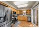 Well-appointed kitchen with stainless steel appliances, custom cabinets, and adjacent dining area at 11704 Elk Head Range Rd, Littleton, CO 80127