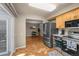 Modern kitchen showcasing stainless steel appliances and eat in dining area at 11704 Elk Head Range Rd, Littleton, CO 80127