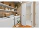 Well-equipped laundry area with modern appliances, ample storage, and convenient access to household essentials at 11704 Elk Head Range Rd, Littleton, CO 80127