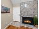 Close up of living room showcasing fireplace, flooring, and the front door at 11704 Elk Head Range Rd, Littleton, CO 80127