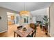 Open concept living space featuring dining area, living room with fireplace and kitchen at 11704 Elk Head Range Rd, Littleton, CO 80127