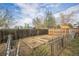 Fenced backyard featuring garden beds, offering a perfect space for gardening and outdoor activities at 3620 N Saint Paul St, Denver, CO 80205
