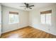 Bright bedroom with hardwood floors, ceiling fan and natural light from the two windows at 3620 N Saint Paul St, Denver, CO 80205