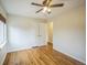 Bedroom featuring hardwood floors, a ceiling fan, a closet, and a light-filled window at 3620 N Saint Paul St, Denver, CO 80205