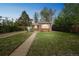 Lovely home with a well-manicured lawn, mature trees, and inviting curb appeal at 3620 N Saint Paul St, Denver, CO 80205